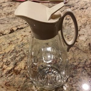 Vintage log cabin glass syrup dispenser.